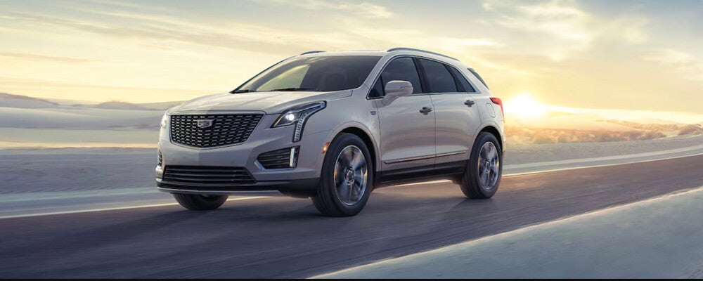 2025 Cadillac XT5 driving on road.