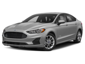 A silver Ford Fusion Hybrid sedan, viewed from the front quarter, against a black background.
