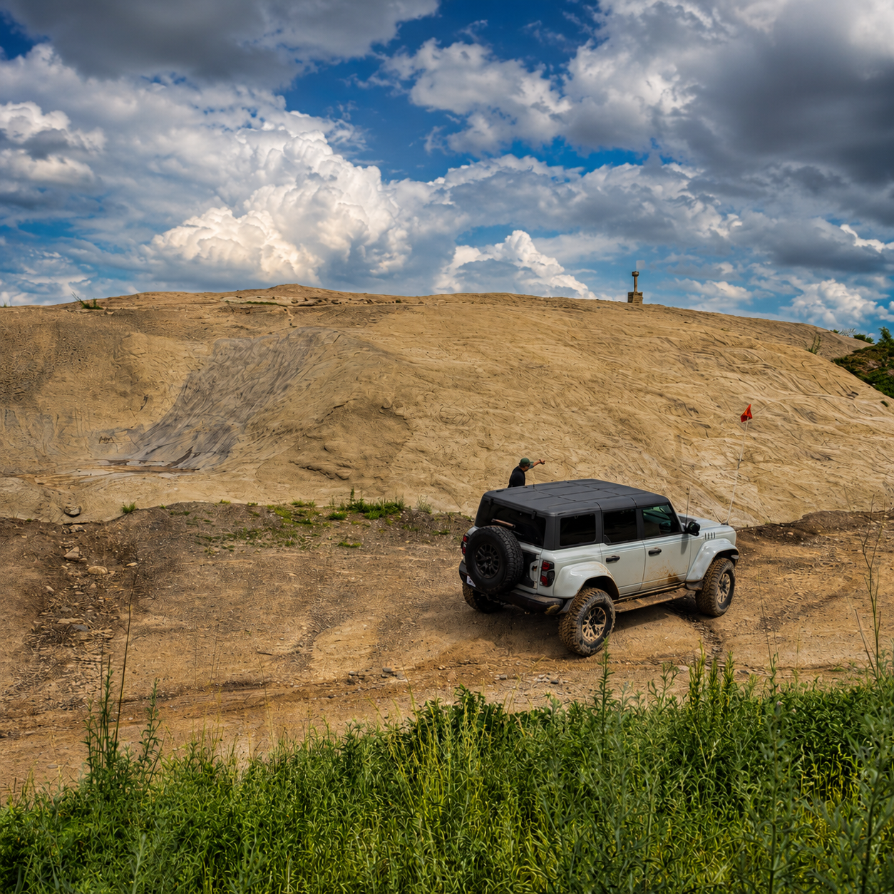 White Bronco at sandy hill climb