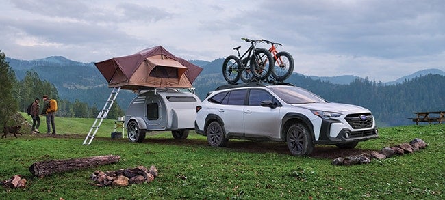 Subaru Outback with rooftop tent and bicycles