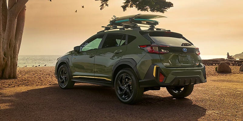 Subaru Crosstrek with surfboards near the beach