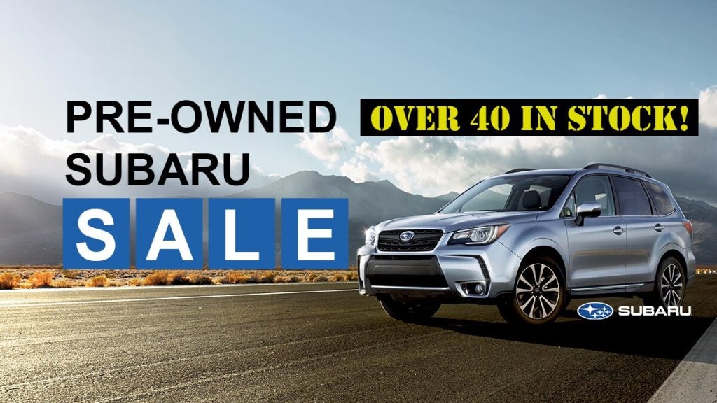 Silver Subaru parked at Dellenbach pre-owned sales event.