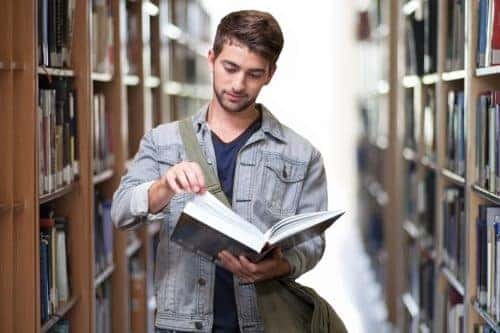 college student reading a book