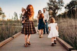 A family on a wooden bridge