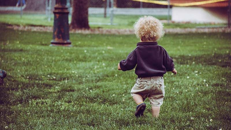 Toddler Running in Park