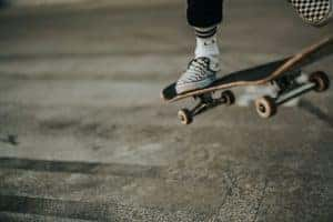 Up close photo of a person performing a skate trick on their skateboard in Streetsboro
