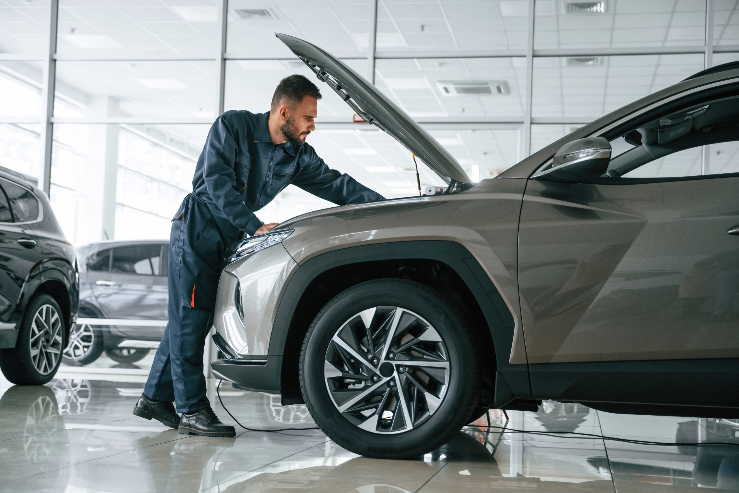 Fixing,The,Vehicle.,Side,View.,Car,Repairman,Is,In,The
