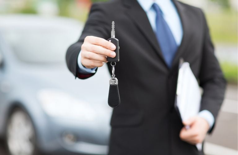 A man holding car keys
