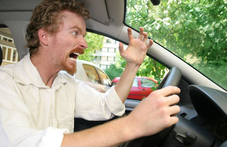 a man getting angry in driving seat