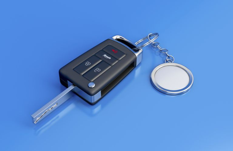 car key fob with keychain on blue background