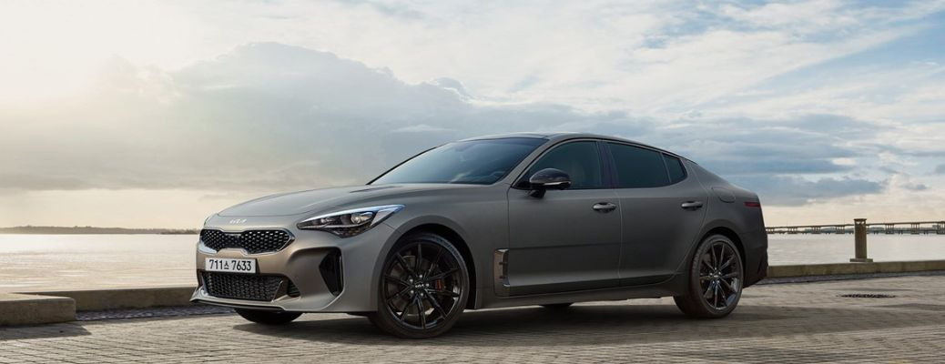 Side profile of a grey 2023 Kia Stinger.