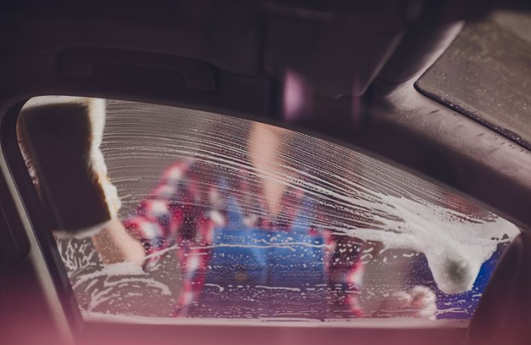 a car's window being cleaned