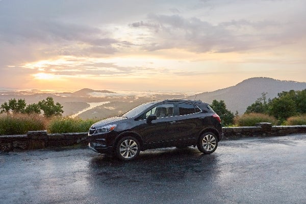 A 2022 Buick Encore parked on a scenic mountain road.