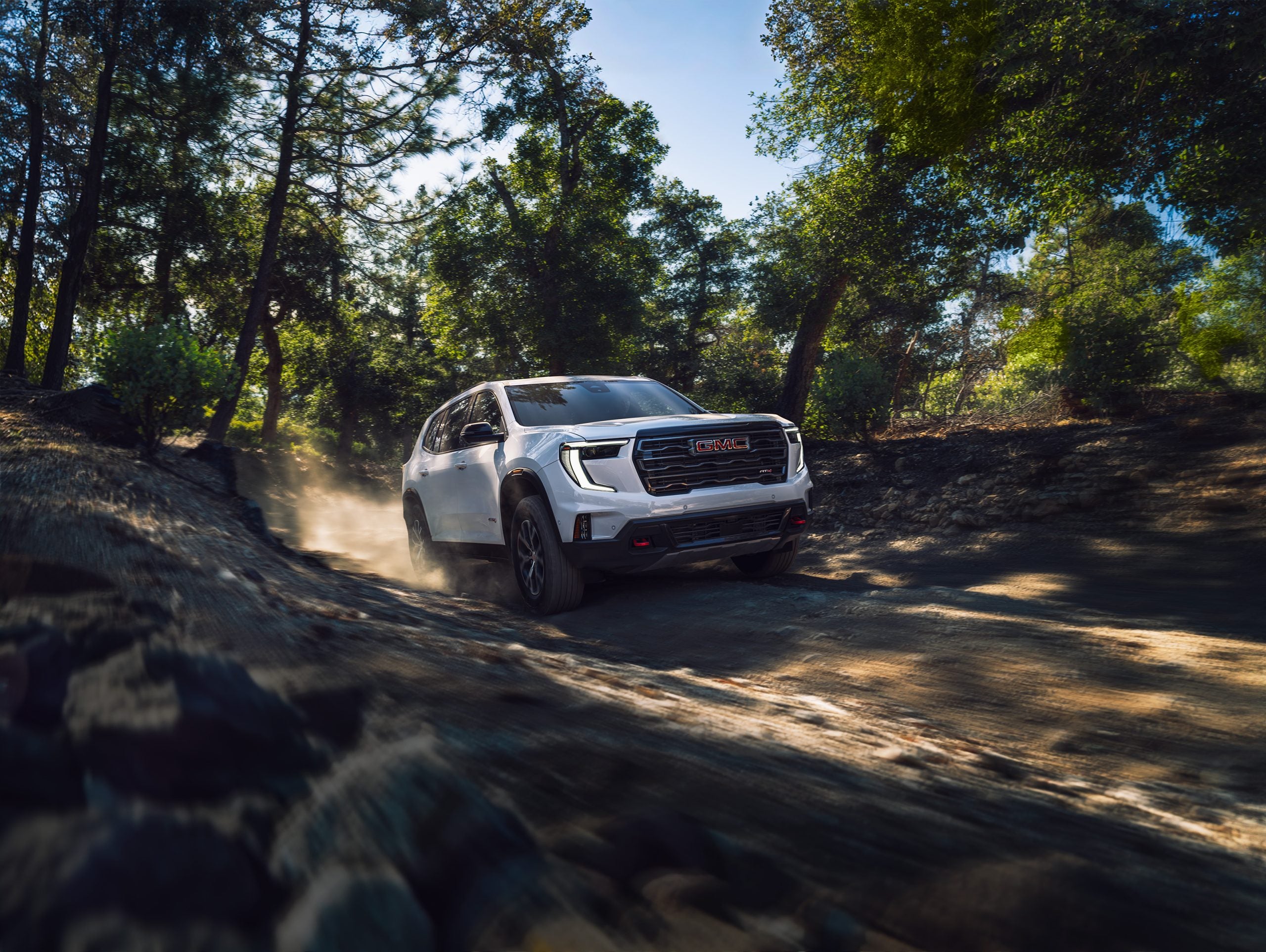 2026 GMC Acadia on a forest road