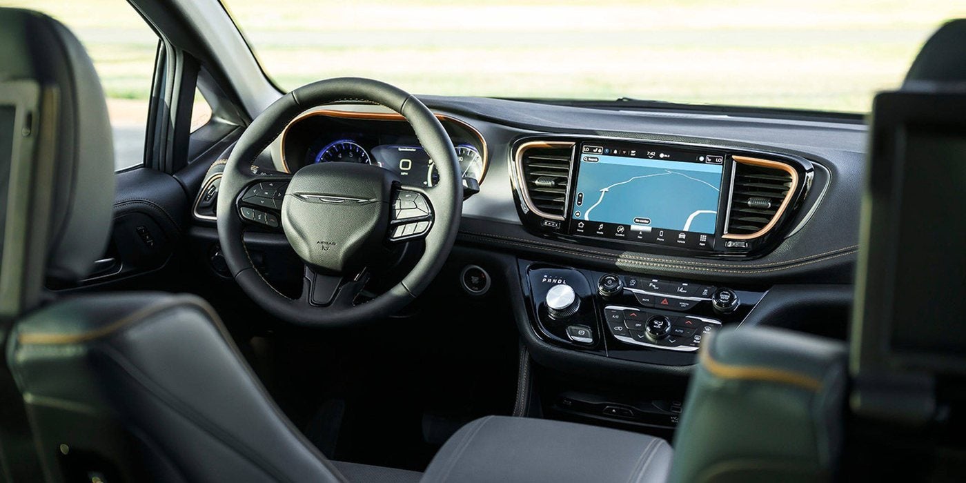 2027 Chrysler Pacifica dashboard with the Uconnect touchscreen and digital cluster display, at Ross Downing CDJR of Mobile, AL