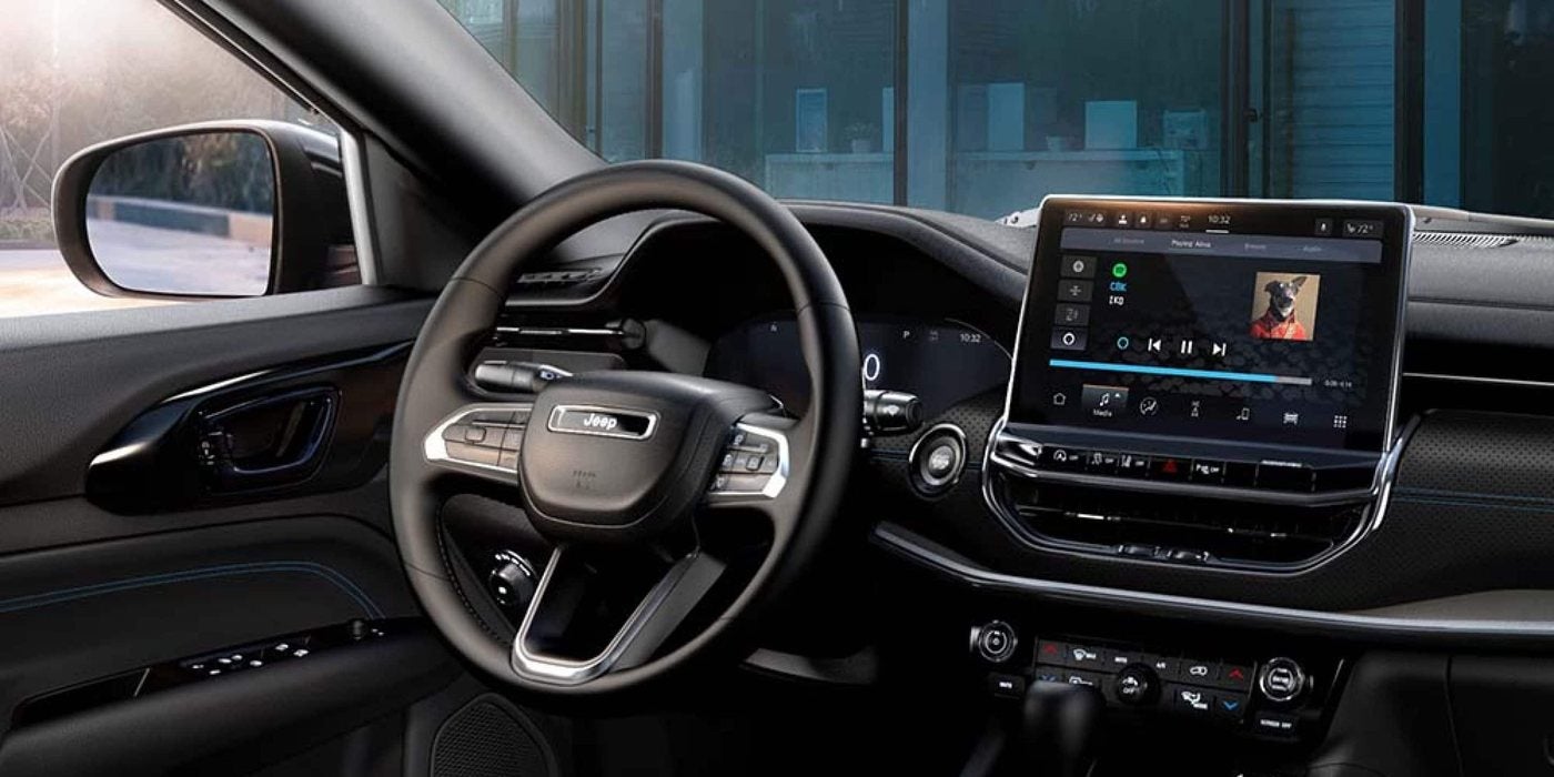 2026 Jeep Compass dashboard with a Uconnect touchscreen and digital gauge cluster, at Ross Downing CDJR of Mobile, AL