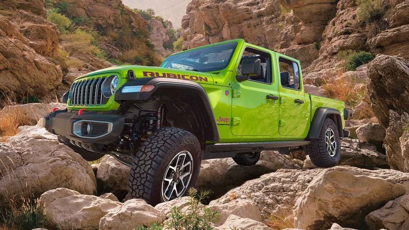 Lime green 2026 Jeep Gladiator Rubicon on a rocky canyon trail; Jeep Gladiator specials at Ross Downing CDJR of Mobile, AL