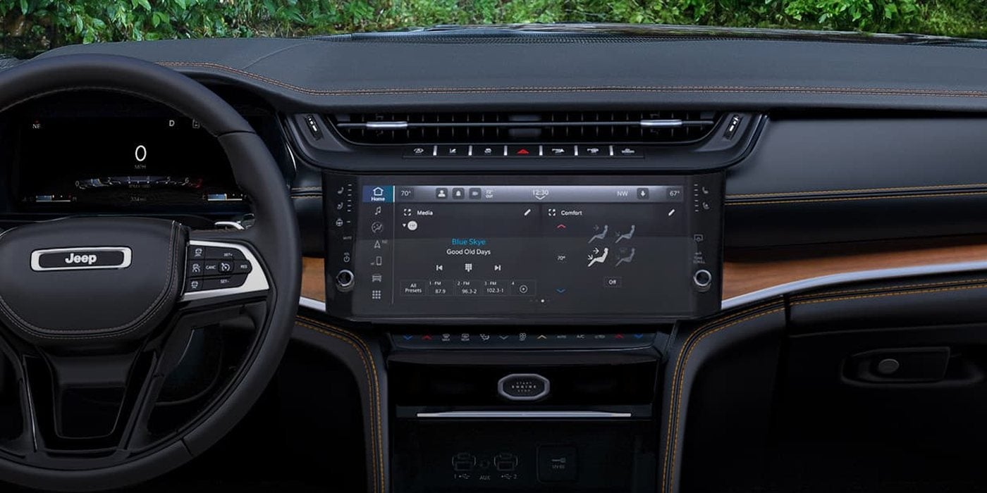 2027 Jeep Grand Cherokee dashboard with the 12.3-inch Uconnect 5 touchscreen and digital gauge cluster, at Ross Downing CDJR of Mobile, AL