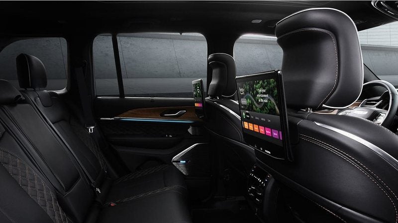Rear-seat entertainment screens on the front seatbacks of a 2026 Jeep Grand Cherokee L; trade in your vehicle at Ross Downing CDJR of Mobile, AL