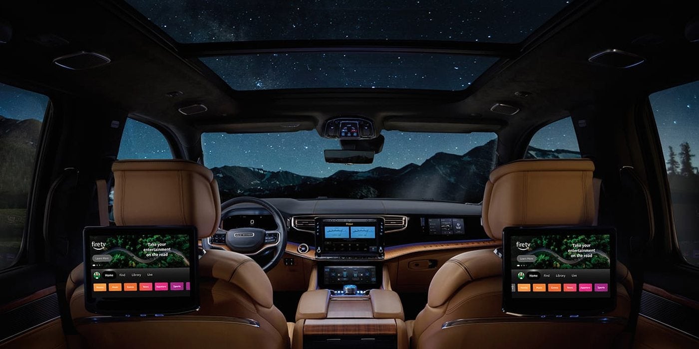 2026 Jeep Grand Wagoneer cabin with saddle leather seats, rear-seat entertainment screens and a glass roof, at Ross Downing CDJR of Mobile, AL