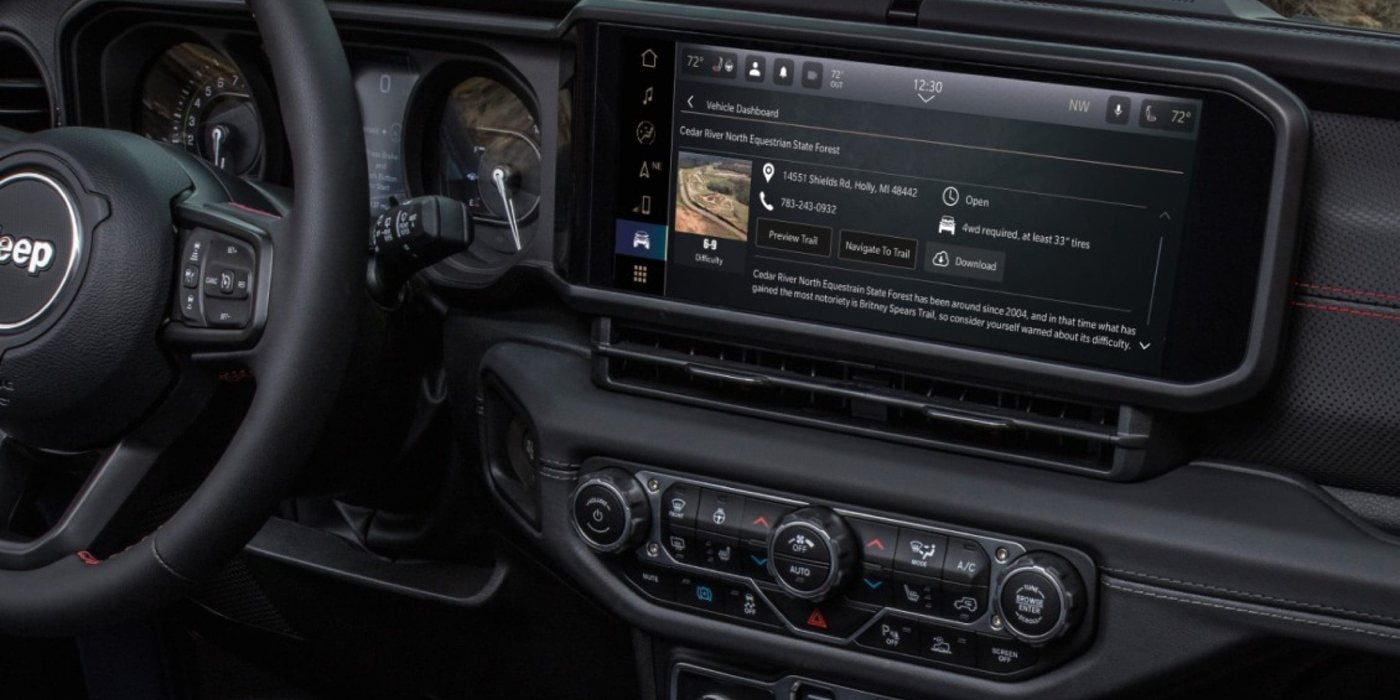2026 Jeep Wrangler dashboard with the 12.3-inch Uconnect touchscreen, at Ross Downing CDJR of Mobile, AL