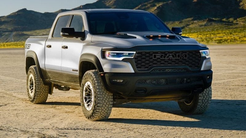 Gray 2027 Ram 1500 off-road model on a dry lakebed; trade in your vehicle at Ross Downing CDJR of Mobile, AL