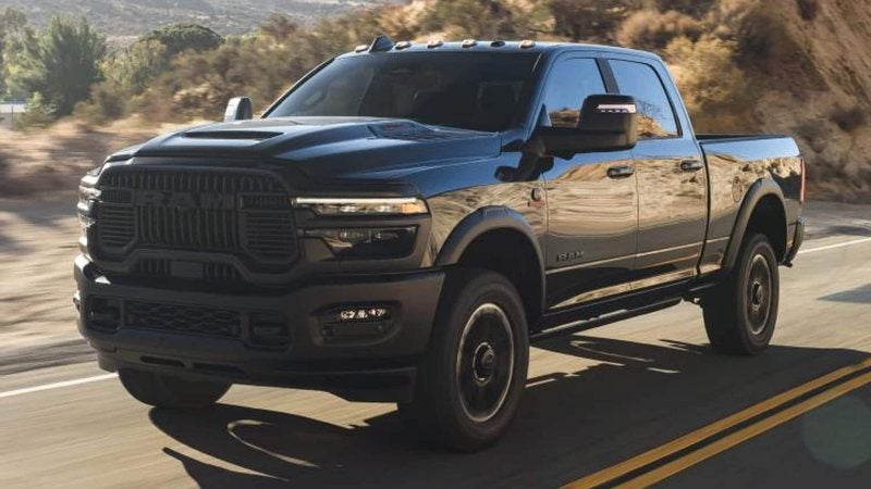 Black 2026 Ram 2500 Crew Cab on a mountain highway; Ram 2500 specials at Ross Downing CDJR of Mobile, AL