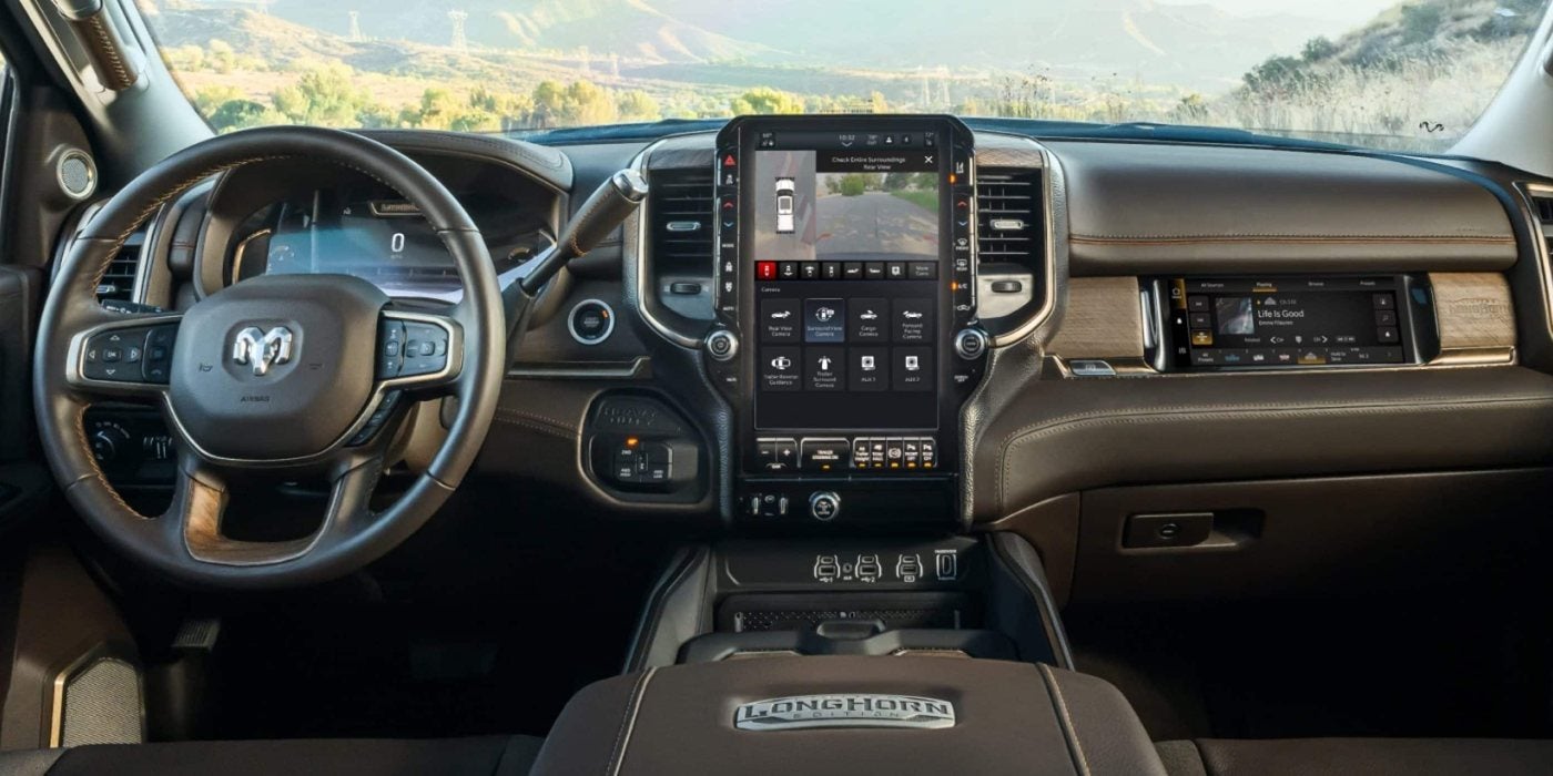 2027 Ram 2500 Limited Longhorn dashboard with the vertical Uconnect touchscreen and passenger display, at Ross Downing CDJR of Mobile, AL