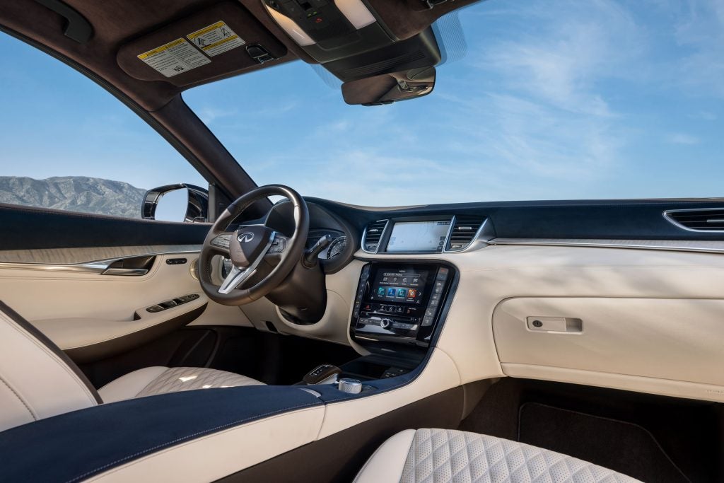 Interior view of Infiniti QX50 looking towards the dashboard, steering wheel, and front passenger seat.