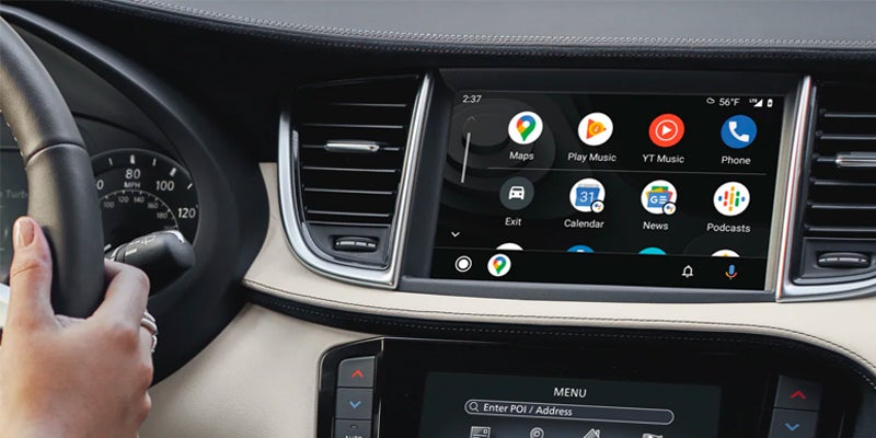 Car Infiniti QX50 infotaiment screen displaying apps like Maps, Play Music, YT Music, Phone, Exit, Calendar, News, and Podcasts.