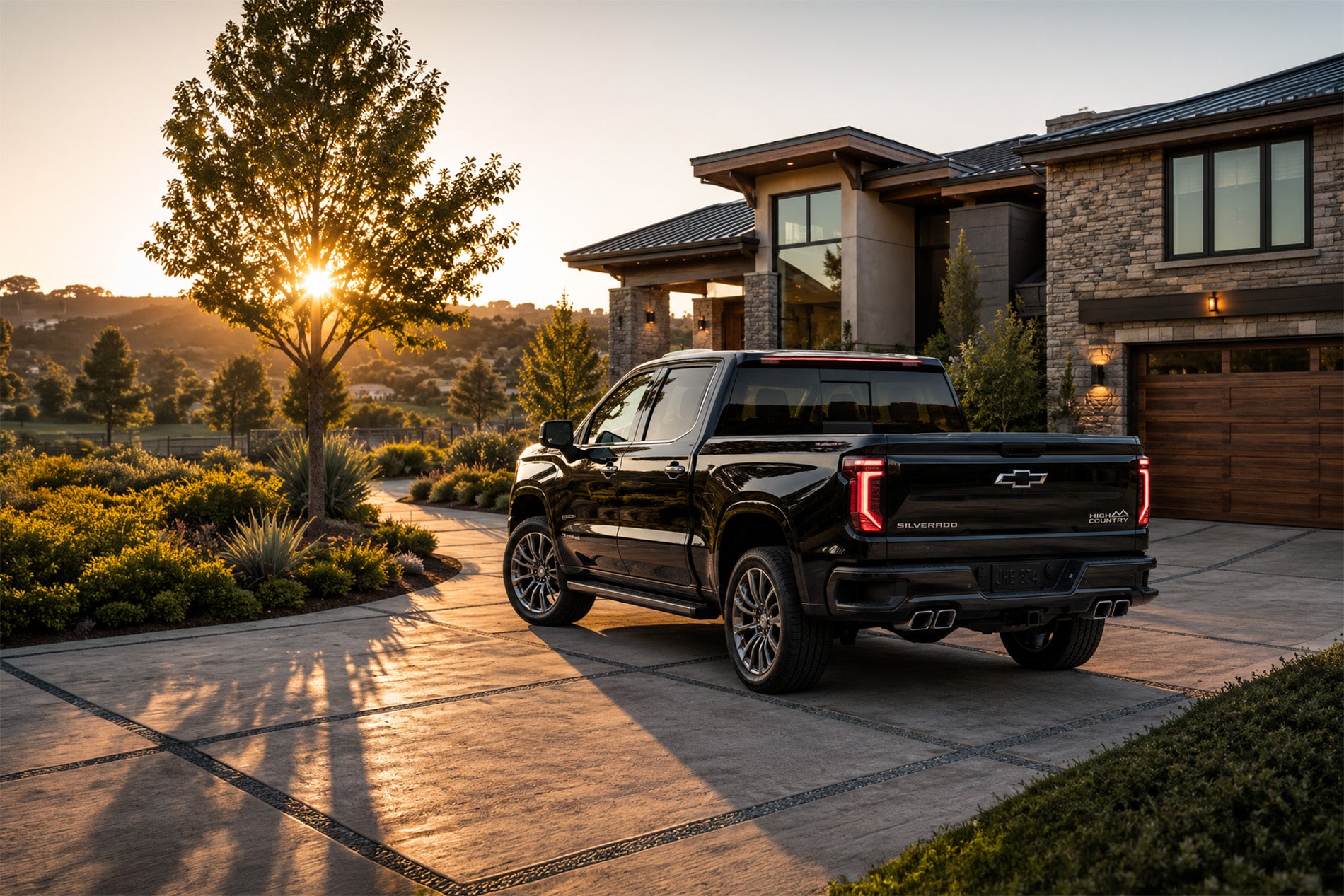 2027 Chevrolet Silverado 1500 High Country parked in a residential driveway at sunrise.