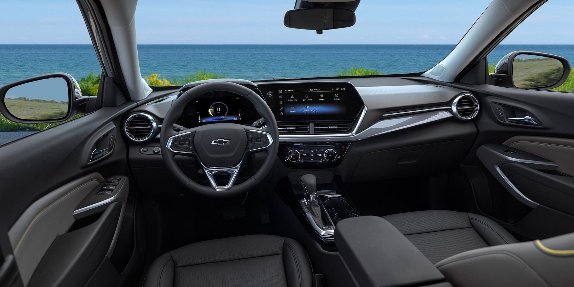2026 Chevy Trax interior front cabin with dashboard, steering wheel, touchscreen display, and front seating