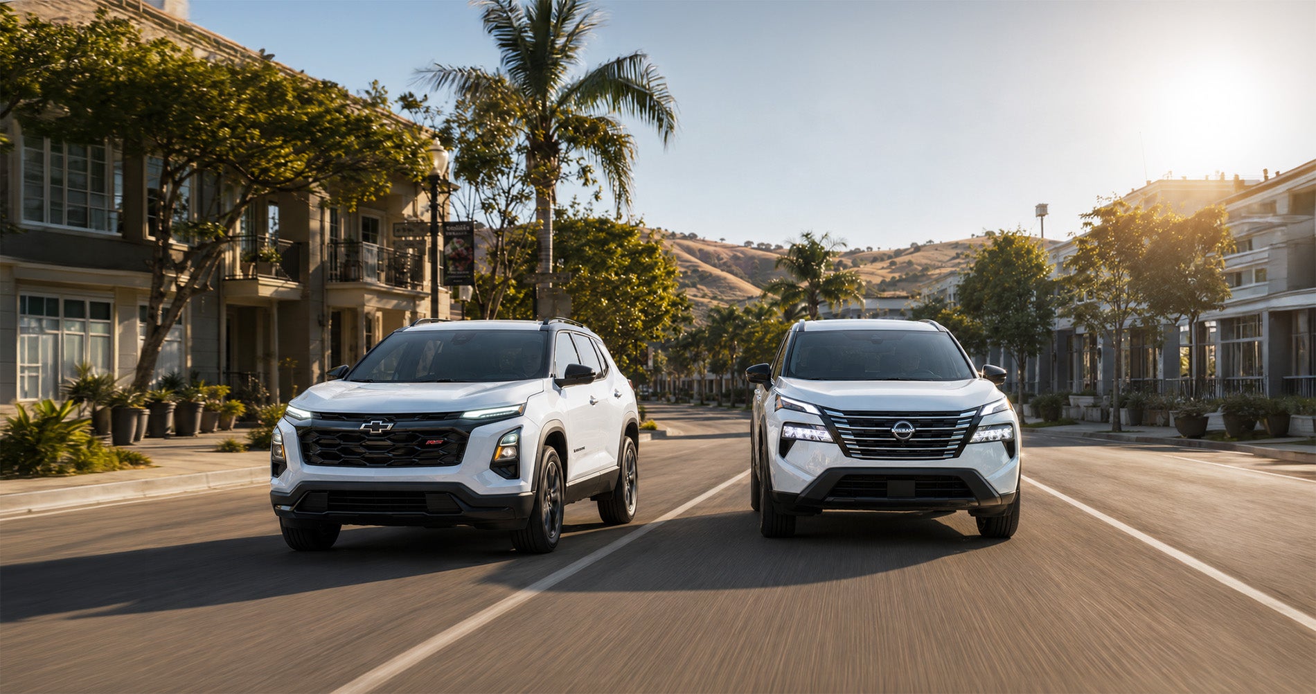 Two white SUVs—a 2027 Chevrolet Equinox and a 2026.5 Nissan Rogue—driving side by side through downtown Pittsburg, California, with palm trees, modern buildings, and hills in the background under bright morning sunlight, emphasizing their sleek urban styling and performance.