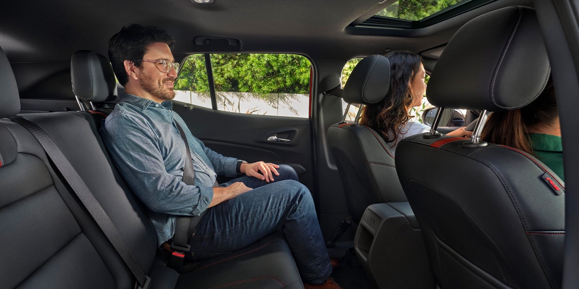 2026 Chevy Trax interior rear seating area with split-folding second-row seats and dark upholstery