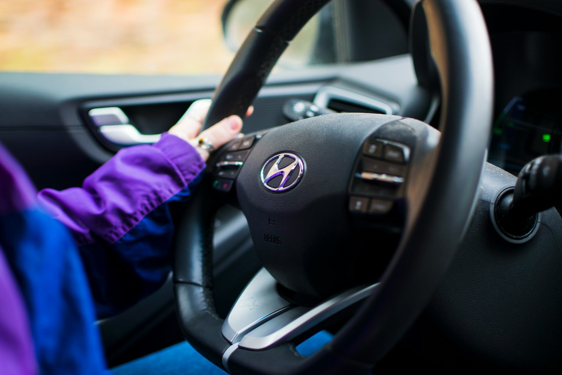 Full interior view digital display, black color steering wheel.