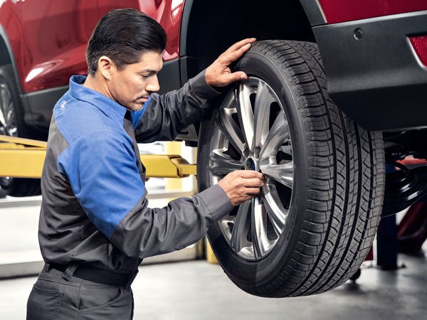 Ford Service Tech Mounting a Tire