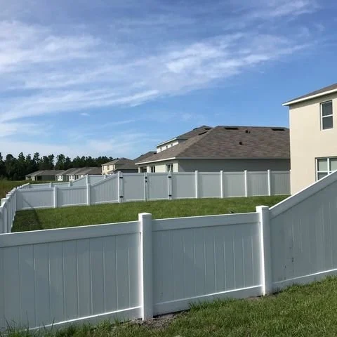 wooden vinyl fence around a house