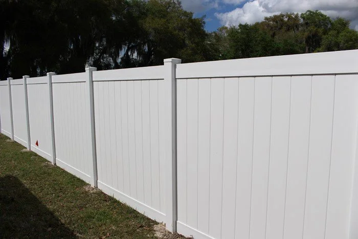 wooden vinyl aluminum fence around a house