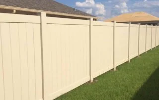 wooden vinyl fence around a house