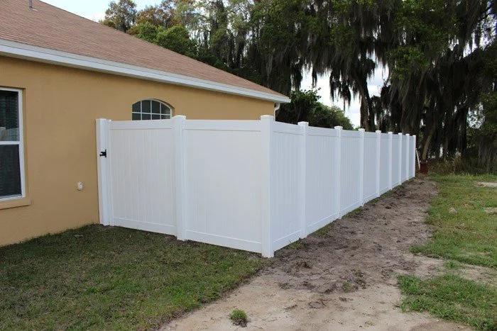wooden vinyl aluminum fence around a house