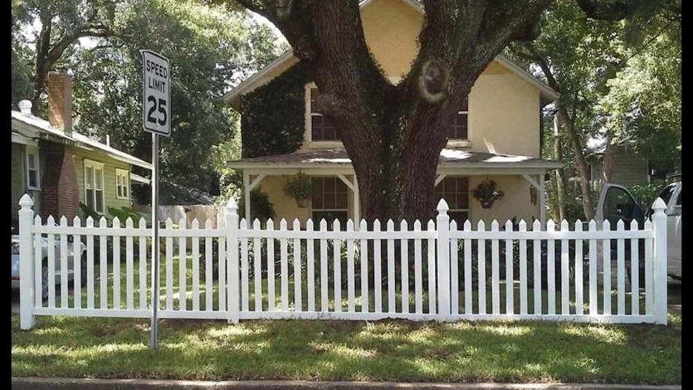 wooden, vinyl fence around a house