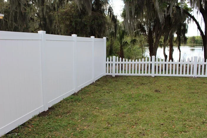 wooden vinyl fence around a lake