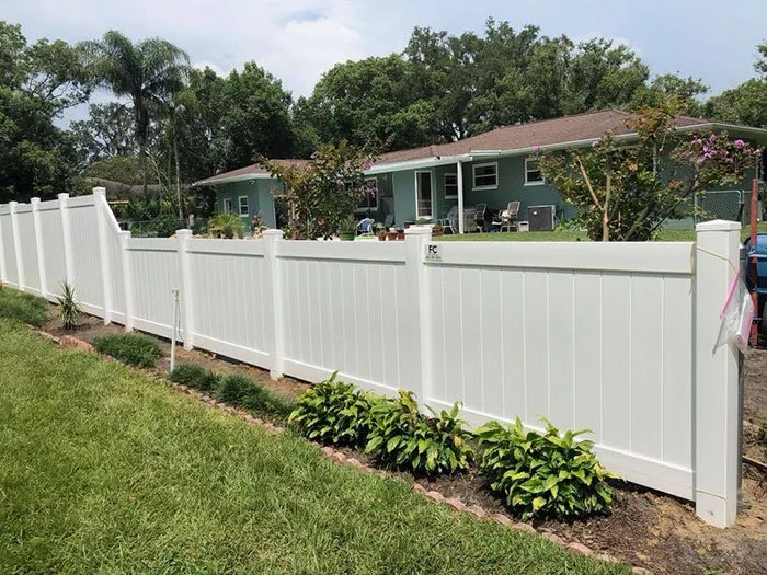 wooden vinyl fence around a house