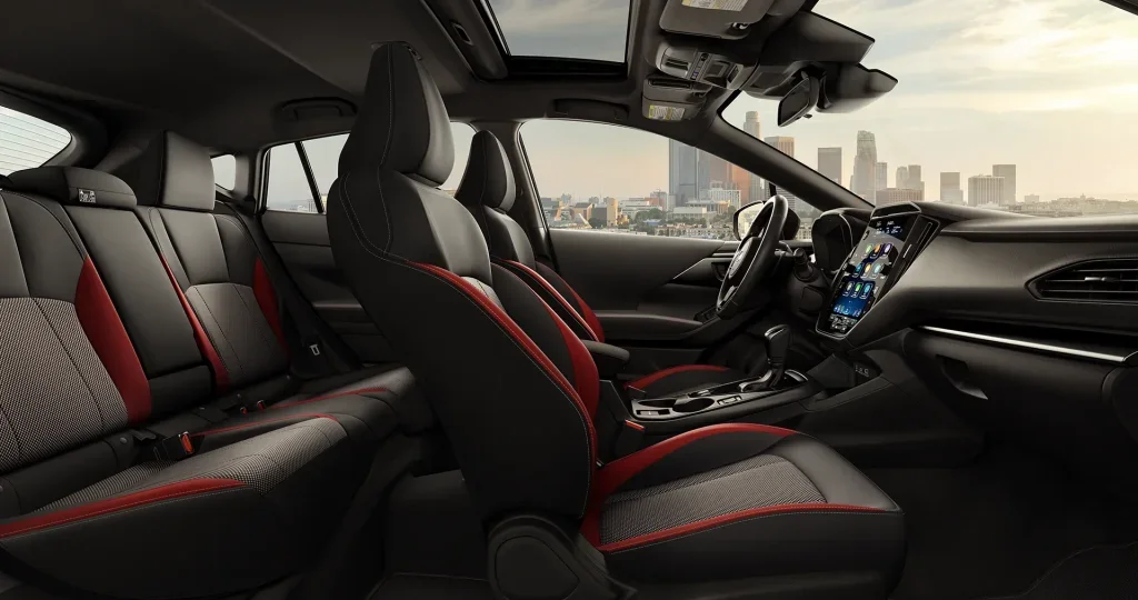 Modern vehicle interior with touchscreen display, premium seats, and panoramic sunroof.