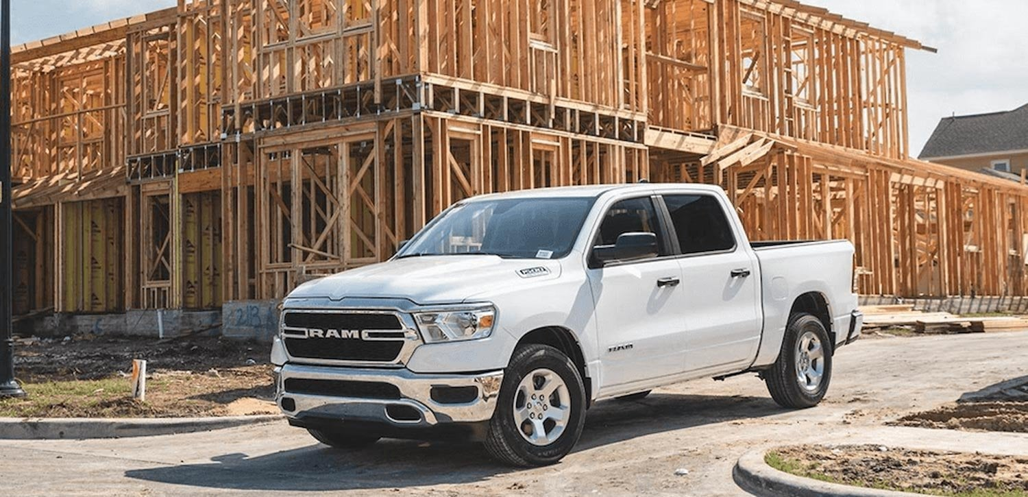 A White Ram pickup truck parked on a road.