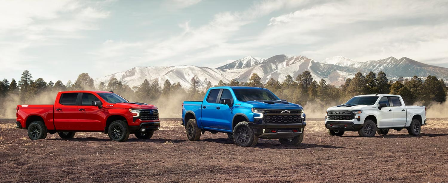 Chevrolet pickup truck driving through desert sand