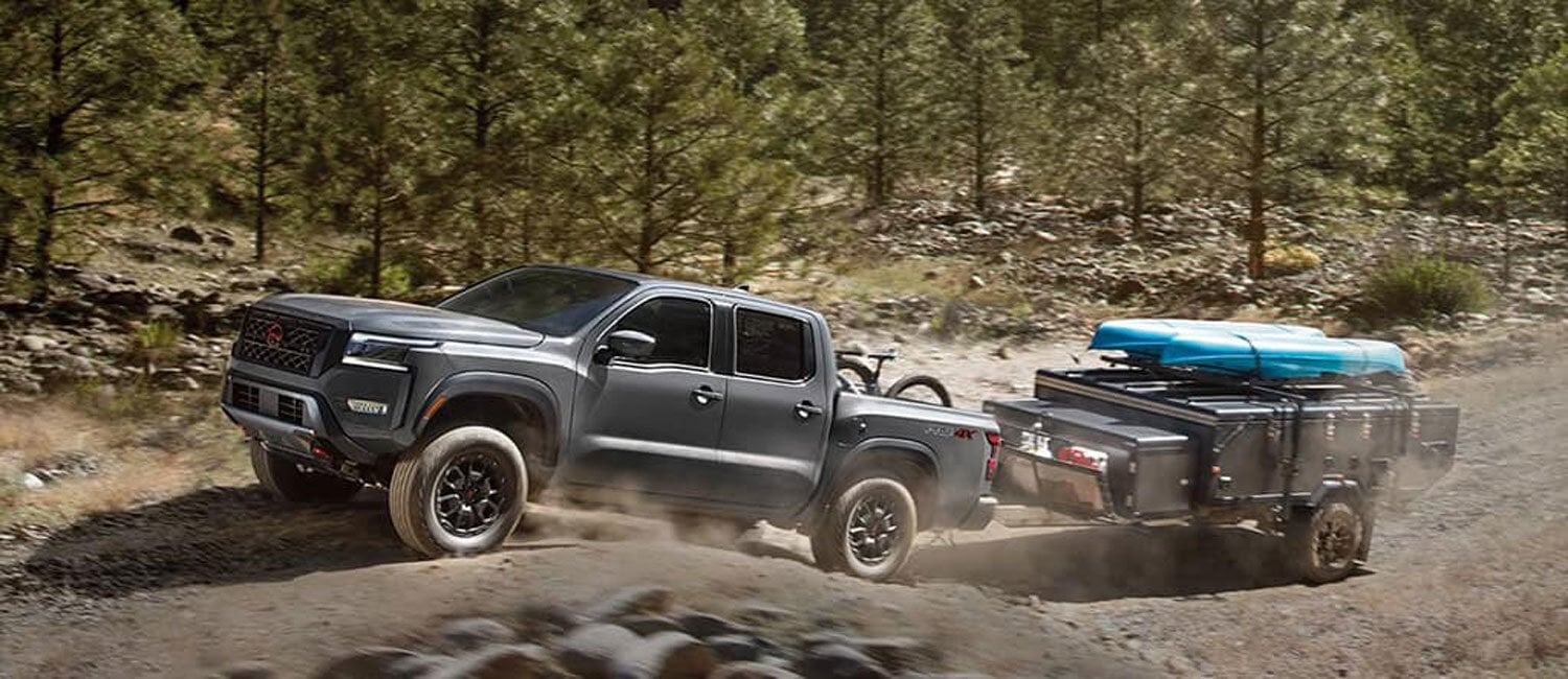 Nissan Frontier truck highlighting towing, hauling capability, and off-road performance.
