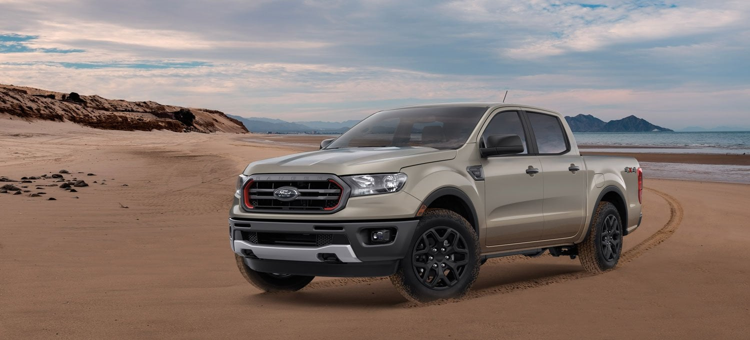 Ford Ranger driving on dusty terrain.