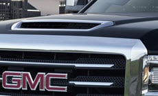 A black GMC Yukon Denali SUV 