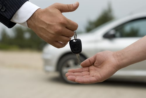 Car key being handed over.